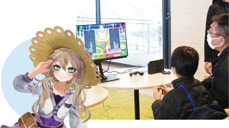 春日部つくしさんの画像とeスポーツ体験会をしている様子