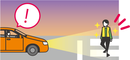 反射材を着けた人が横断歩道を渡るイラスト